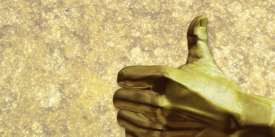 Goldene Hand mit erhobenem Daumen